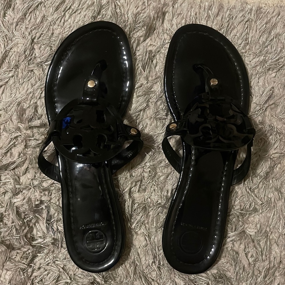 Black patent leather flip flops